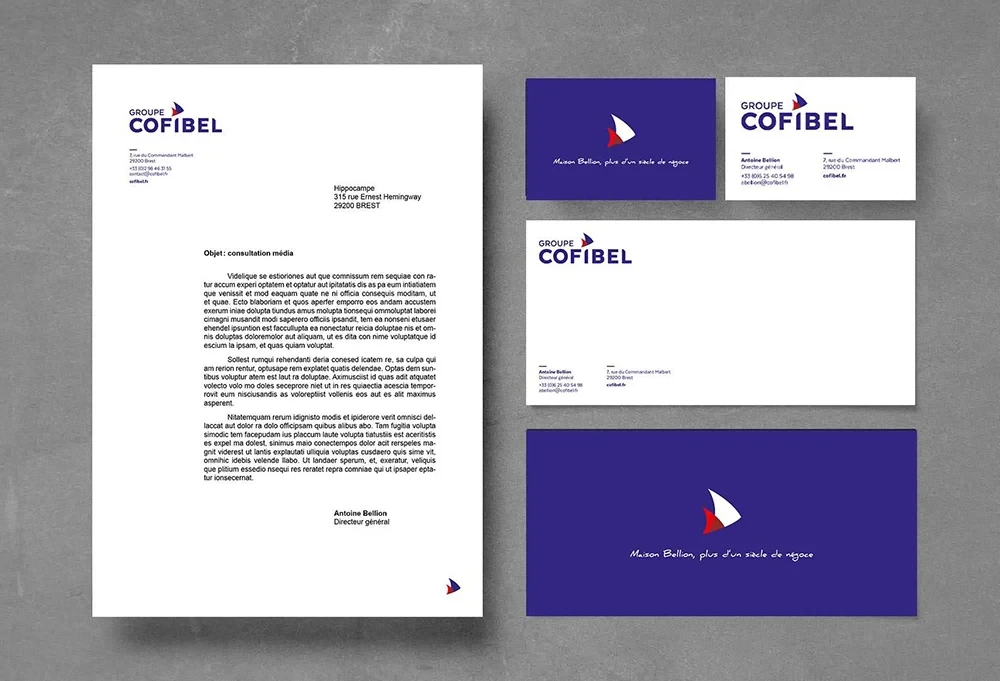 Papeterie institutionnelle du groupe Cofibel comprenant papier à en-tête, cartes de visite et enveloppes, illustrant la nouvelle identité visuelle et la cohérence graphique de la marque.